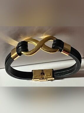 Black Faux Leather Bracelet with Gold tone Infinity Link, and hardware. (NWOT)